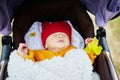 1 month old baby girl sleeping in perambulator Royalty Free Stock Photo