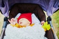 1 month old baby girl sleeping in perambulator Royalty Free Stock Photo