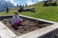 18 month old toddler enjoying the sunshine up on Seiser Alm Plat