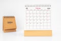 Monthly desk calendar February 2024 year on white table