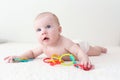 4 months baby with educational toy teether at home