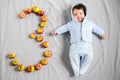 3 months baby. Portrait of an adorable 3 month old baby in the bedroom on the bed in white clothes