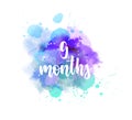 9 months - handwritten lettering on watercolor splash Royalty Free Stock Photo