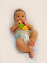 3 months old baby boy playing with teething toy