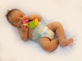 3 months old baby boy playing with teething toy