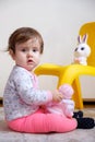 10 months old baby girl playing with toys. Portrait of a cute little girl Royalty Free Stock Photo