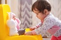 10 months old baby girl playing with toys. Portrait of a cute little girl Royalty Free Stock Photo