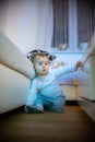 11 months old baby girl watching television like hypnotized. health and development problems concept Royalty Free Stock Photo