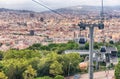 Montjuic Cable Cars and cityscape on background, Barcelona, Catalonia, Spain