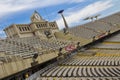 Montjuic Olympic Stadium.Clock above empty tribunes on sport arena.