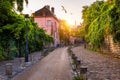 Montmartre district of Paris. Houses on narrow road in Montmartre district of Paris. View of cozy street in quarter Montmartre in Royalty Free Stock Photo