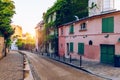 Montmartre district of Paris. Houses on narrow road in Montmartre district of Paris. View of cozy street in quarter Montmartre in