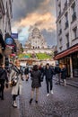 Montmartre shopping district and Sacre Coeur cathedral with tourists