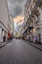 Montmartre shopping district and Sacre Coeur cathedral with tourists