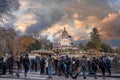 Montmartre shopping district and Sacre Coeur cathedral with tourists