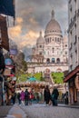 Montmartre shopping district and Sacre Coeur cathedral with tourists