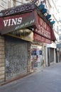 Closed wine shop in paris with graffiti