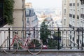 Montmartre streets in Paris, France, Europe. Red Bicycle on cozy cityscape of architecture and landmarks. Travel Royalty Free Stock Photo