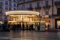 Montpellier, Occitanie, France - Carousel at night at the Place de la Comedie, the Comedy Square with historical houses and people Royalty Free Stock Photo