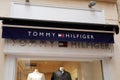 Tommy Hilfiger sign brand and text logo store front of American clothing company Royalty Free Stock Photo