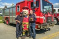 Montreal Auxiliary fireman with Fire Truck and a Mascot