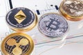 Cryptocurrency coins over tablet screen Royalty Free Stock Photo