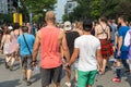 Gay Male Couple - Two gay men are walking together and holding t