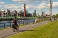 Cyclists and walkers along the Lachine Canal in Montreal, Canada