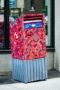 Canada Post mailbox covered with colorful stickers in downtown Montreal Royalty Free Stock Photo