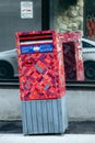Canada Post mailbox covered with colorful stickers in downtown Montreal Royalty Free Stock Photo