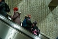MONTREAL, CANADA - Jan 16, 2013: Four People Climbing up Automatic Stairs, all in Winter Clothes Royalty Free Stock Photo
