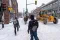 Pedestrians walking on Mont-Royal Avenue during snow storm Royalty Free Stock Photo