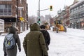 Pedestrians walking on Mont-Royal Avenue during snow storm Royalty Free Stock Photo