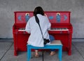 Woman Playing Outdoor Piano