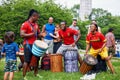 African American male and female percussionists playing djembe and dunun drums at Tam Tams festival in Mount Royal Park