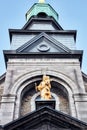 Golden sculpture of virgin Mary holding baby Jesus on the Notre Dame de Bon Secours Chapel in Montreal Quebec, Canada Royalty Free Stock Photo