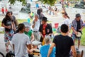 Group of African American, Latin, and Caucasian drummers and percussionists playing rhythm at Tam Tams festival