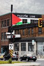 Palestine flag and free palestine palestine libre slogan painted on the brick walls of a building in Montreal, Canada Royalty Free Stock Photo