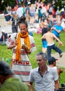 Young new age hippie man playing sounds with a mortar and pestle grinder at tam tams festival in Mount Royal Park