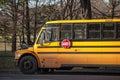 North American Yellow School Bus parked, waiting for students, with the text translated in French Royalty Free Stock Photo