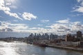 Molson Brewery & a cargo ship in the industrial port of Montreal, Quebec, with the skyline and center business district