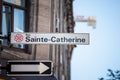 Street sign indicating Rue Sainte Catherine Street in Montreal, Quebec. Located in downtown, Royalty Free Stock Photo