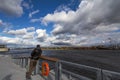 Man standing watching Saint Lawrence river in Montreal, Quebec. Royalty Free Stock Photo