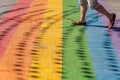 Man walking on gay rainbow crosswalk in Montreal gay village Royalty Free Stock Photo