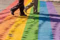 People walking on gay rainbow crosswalk in Montreal gay village Royalty Free Stock Photo