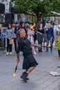 Montreal, Canada - September 4, 2022: Street performance, young juggler and acrobat entertain people in the heart of