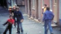 MONTREAL, CANADA 1975: Urban thug Canadian children playing street ball with lacrosse nets.