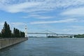 Montreal Clock Tower and Jacques Cartier Bridge at Old Port, Montreal, Canada. Background is a blue cloudy sky. Foreground is Royalty Free Stock Photo