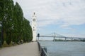 Montreal Clock Tower and Jacques Cartier Bridge at Old Port, Montreal, Canada. Background is a blue cloudy sky. Right is Saint