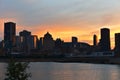 Montreal Downtown skyline at the time between sunset and twilight. Reflections of sun rays on Saint Laurent river